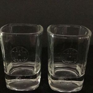 Shot glasses set up to Jack Daniels old number seven shot glass